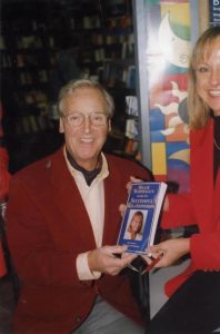 Hillie and Nicholas Parsons and book